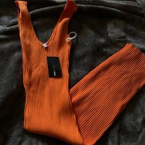 Bright orange dress, size XL but the material is thick and hugs any body shape!